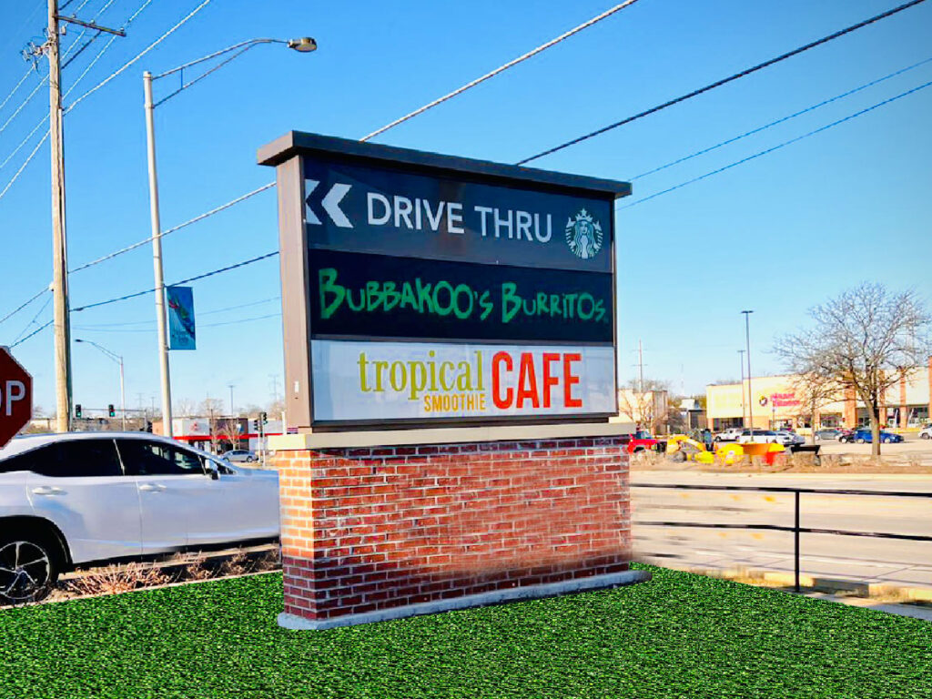 Custom monument sign installed at commercial property entrance