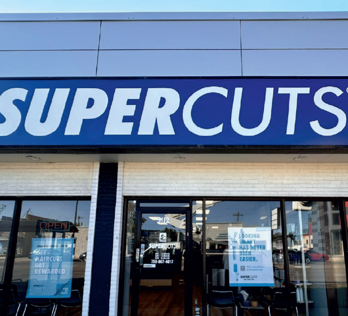 Lightbox sign for SuperCuts Chicago salon, designed and installed by SignFreaks for visibility.