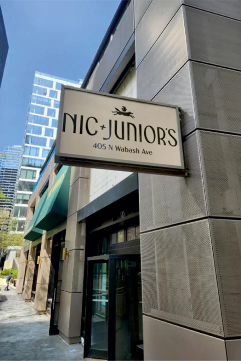 Blade sign for Nick & Juniors Chicago by SignFreaks, improving business visibility.
