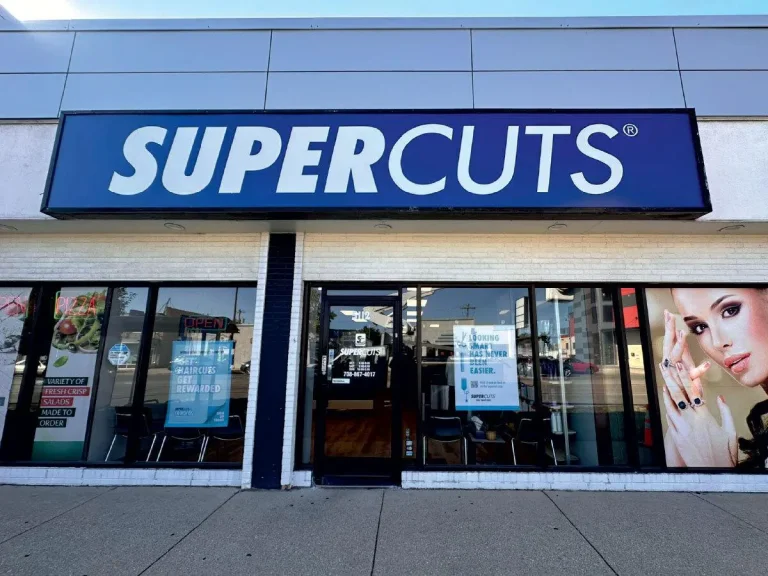 Lightbox sign for SuperCuts Chicago salon, designed and installed by SignFreaks for visibility.