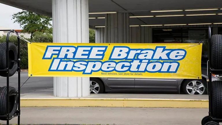 Large format vinyl banner for vehicle shop in Chicago by SignFreaks, attracting customers.